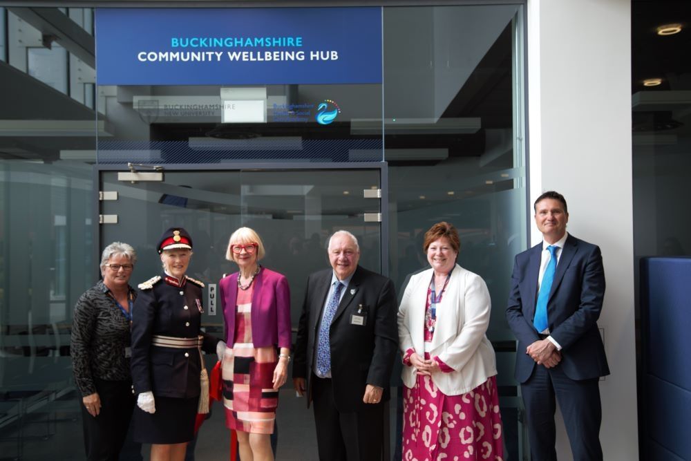 BNU staff and NHS staff standing outside Wellbeing Hub