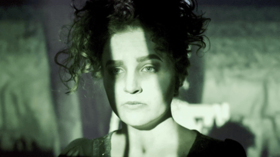 A close up action shot of an Acting student on stage.