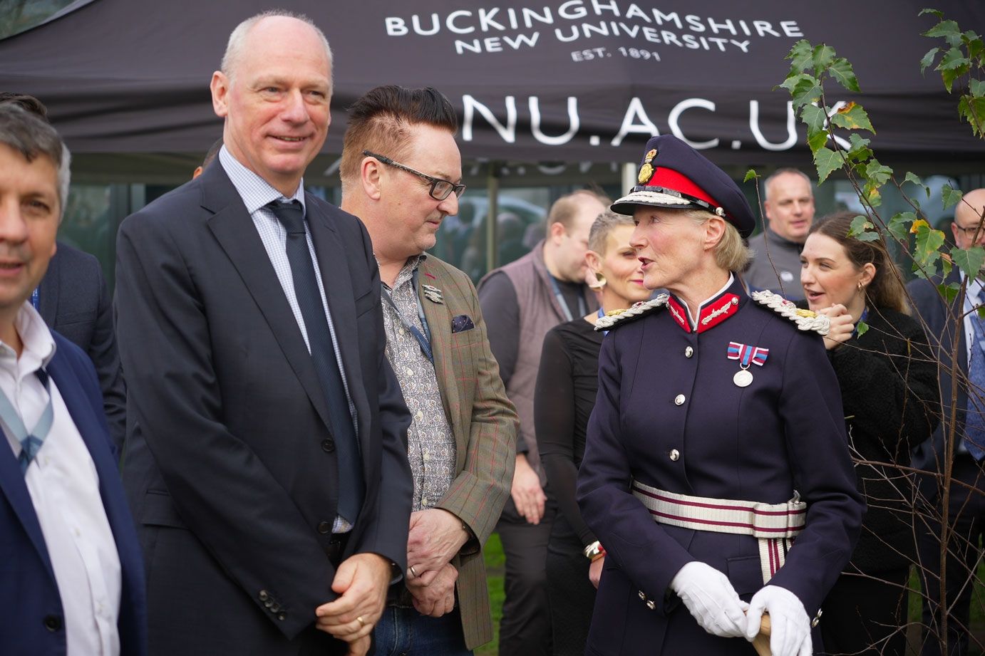 The Countess Howe talking to BNU colleagues by Queens tree