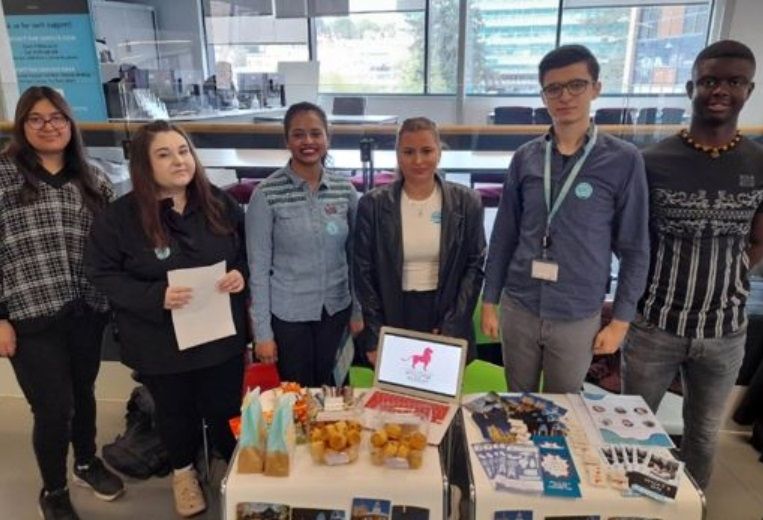 Business students presenting their work at the year-end showcase