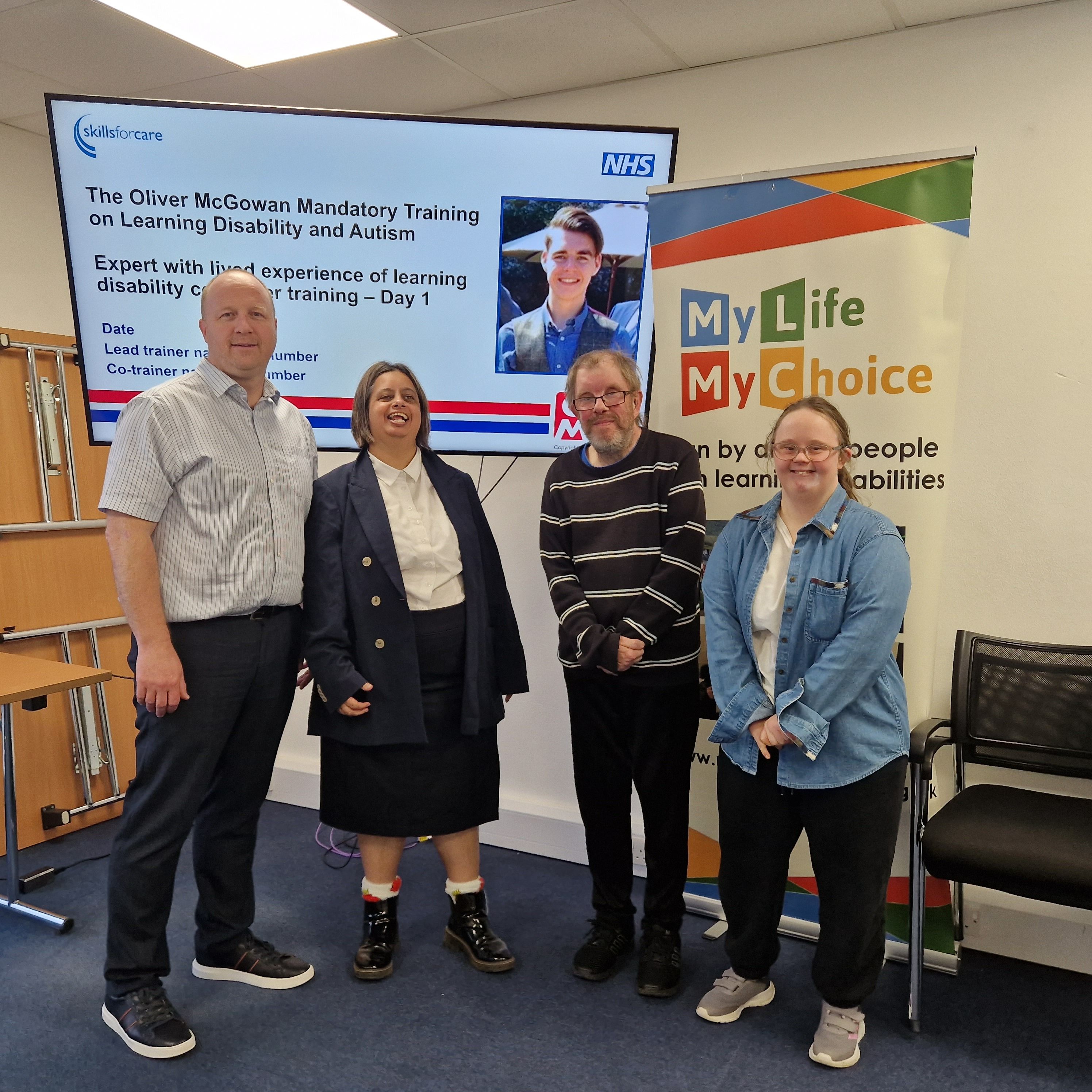 Senior Lecturer Nathan Green stands for photograph with three co-trainers from 'My Life My Choice' charity