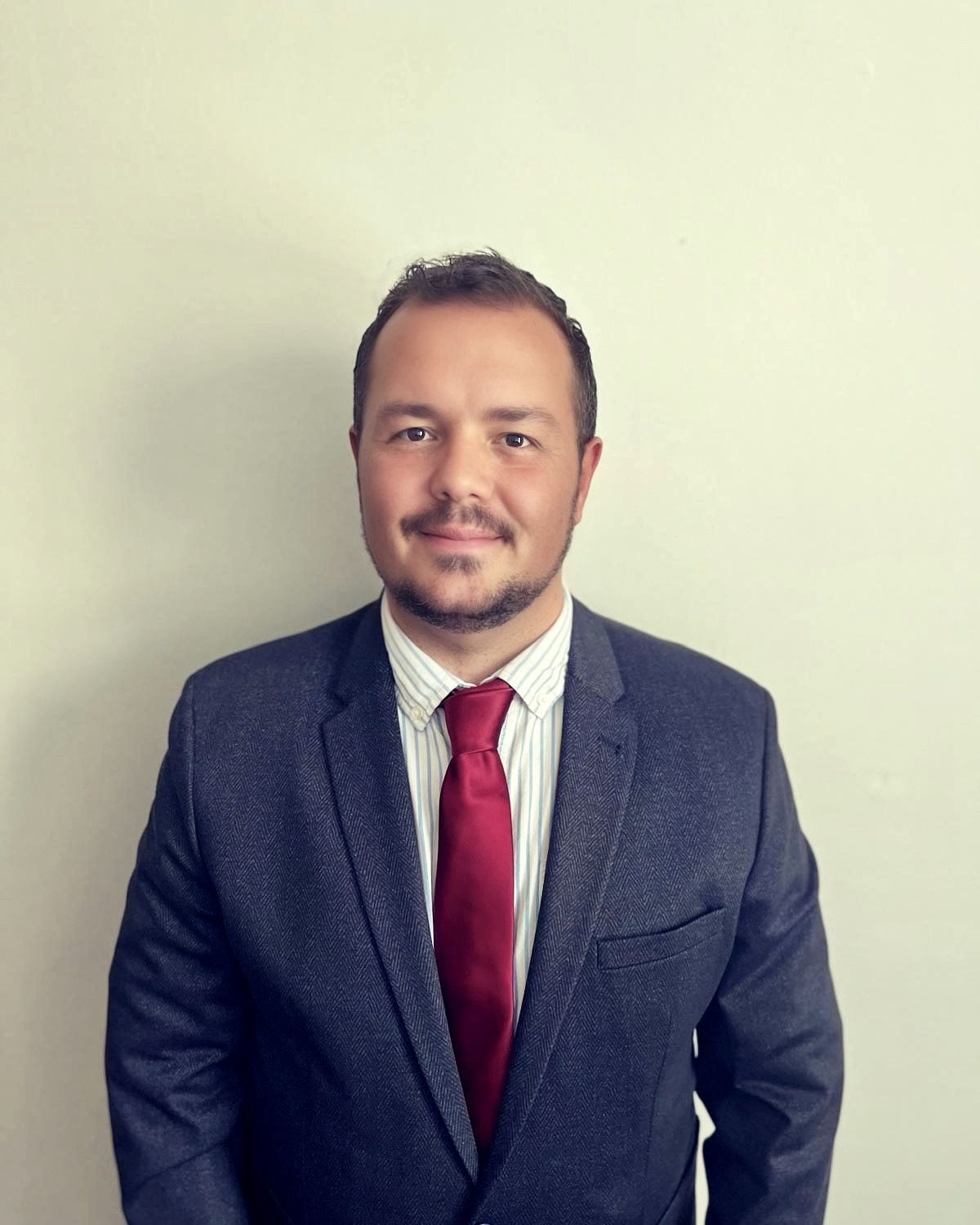 Man in suit smiling at camera