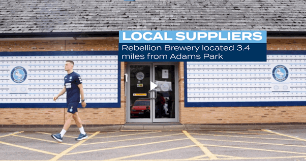 Still from Wycombe Wanderers student film shows David Wheeler walking out of Adams Park stadium