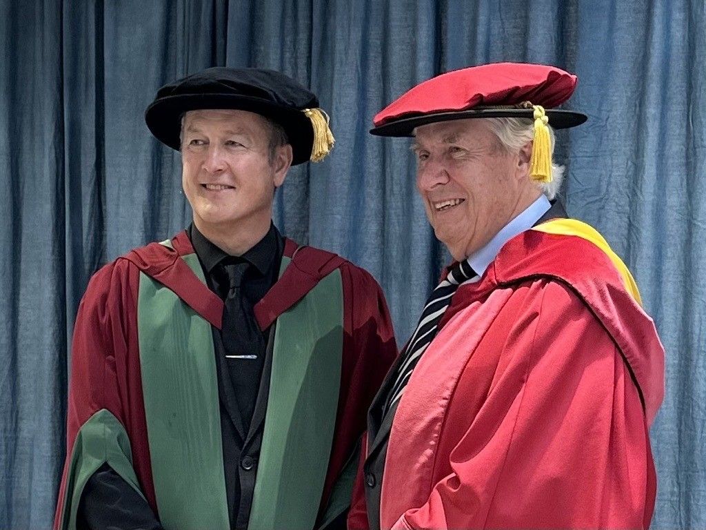 Tim Marshall poses for photograph with Dr Russel Stone