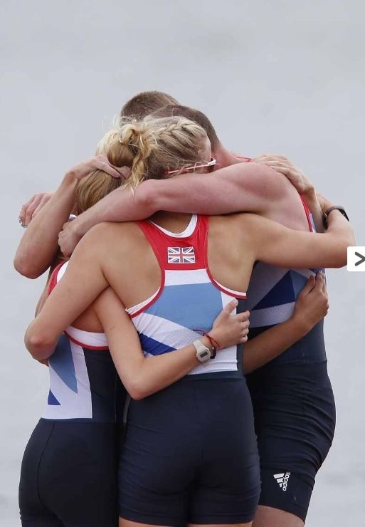 Naomi Riches and her crewmates hug following their gold medal win