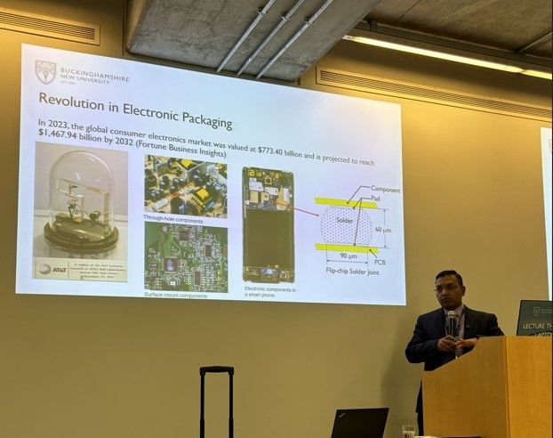 Man at the front of lecture theatre