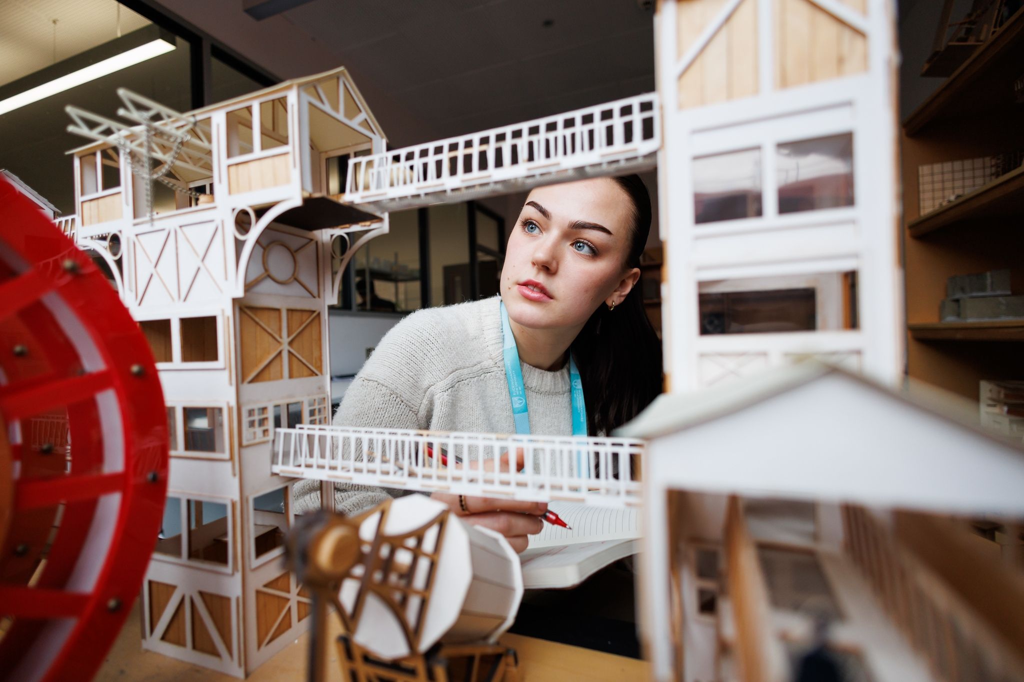 Interior and Spatial student examining an architectural model