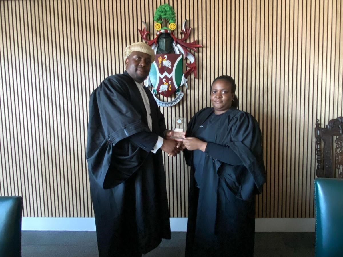 Joy Dellah-Gu with law lecturer