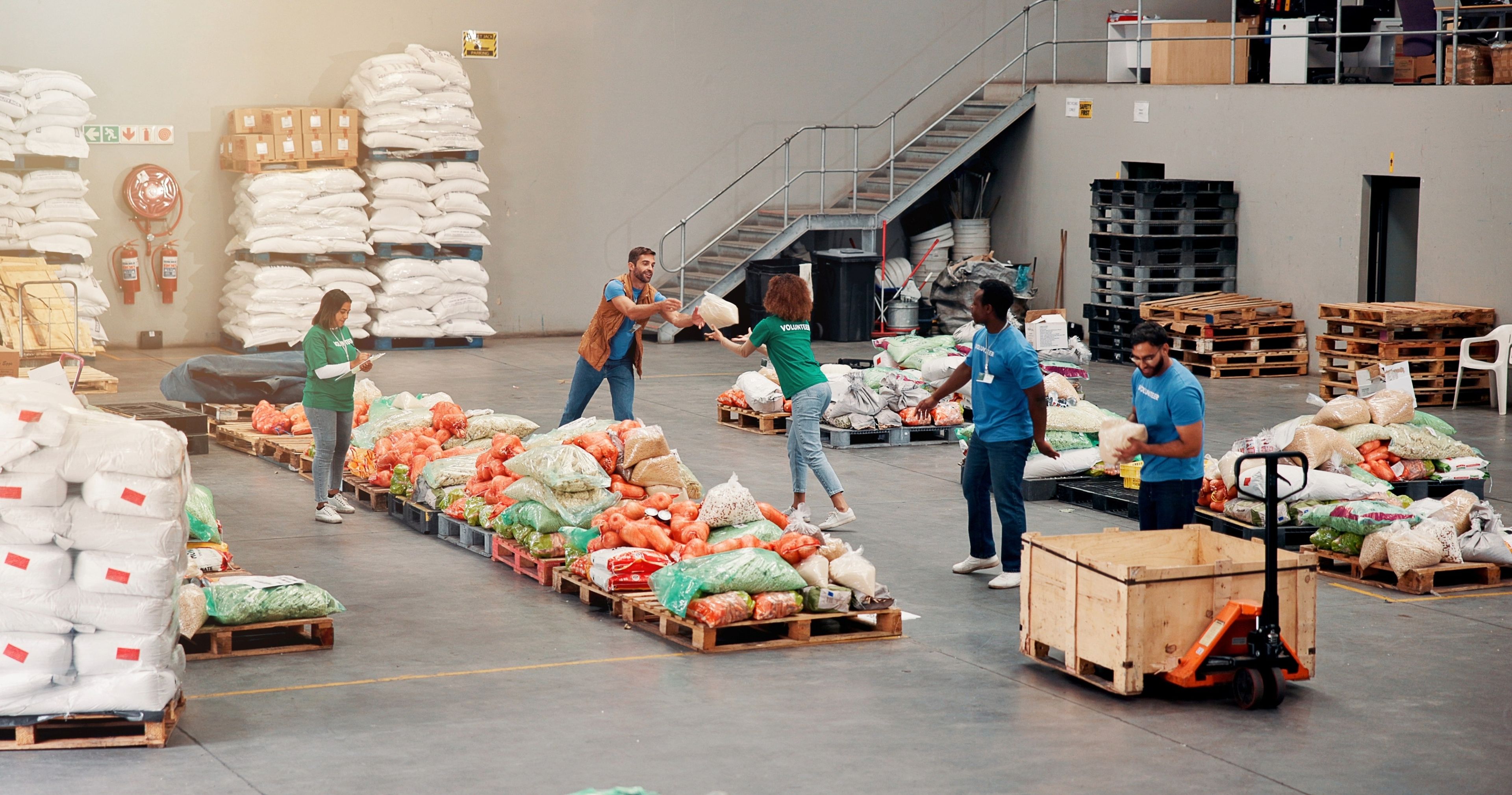 Group of people working in a food distribution warehouse