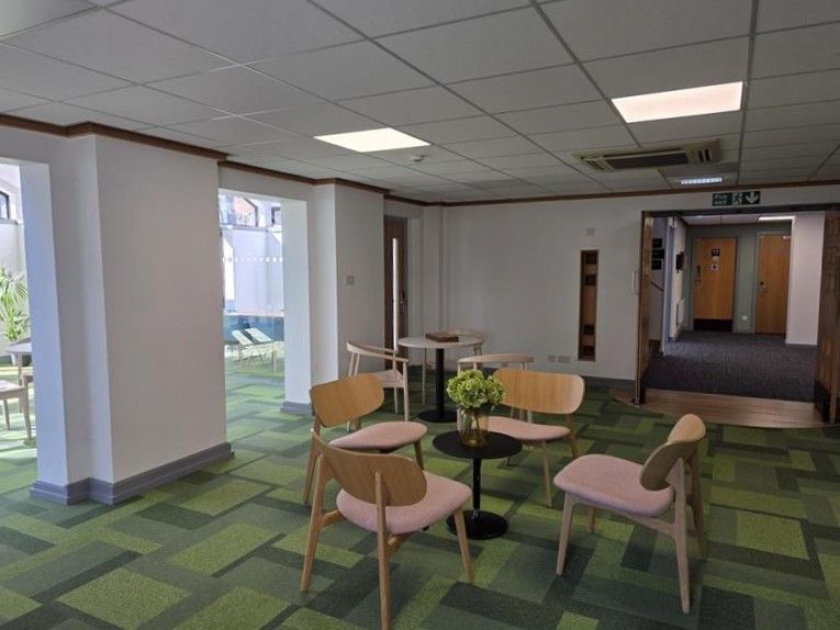 Communal space at Alex House with tables and chairs
